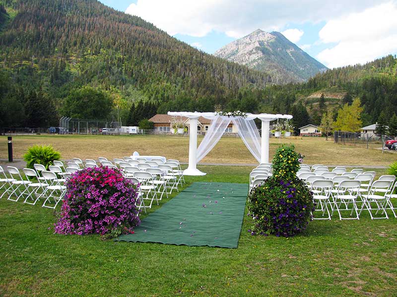 The Beargrass Aisle archway setup for a summer wedding in Waterton Lakes Nation Park.