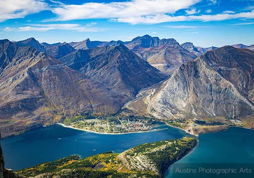 A photo from inside a tent looking out onto the campfire and forest on a summer afternoon.